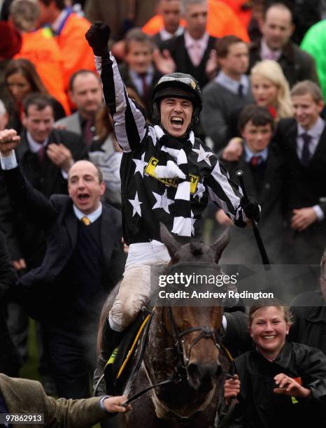 Paddy Brennan celebrates after riding Imperial Commander to victory in the Totesport Cheltenham Gold Cup on Day Four of the Cheltenham Festival on...