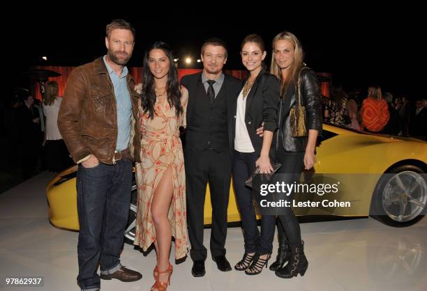 Actors Aaron Eckhart, Olivia Munn, Jeremy Renner, TV personality Maria Menounos, and actress Molly Sims attend the Ferrari 458 Italia auction event...