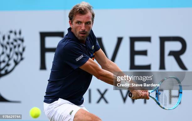 Julien Benneteau of France plays a backhand during his match against Tomas Berdych of The Czech Republic on Day Two of the Fever-Tree Championships...