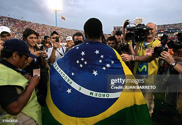 Brazilian forward Robinho celebrates in front cameras at the end of the Copa America Venezuela-2007 final match against Argentina at the Pachencho...