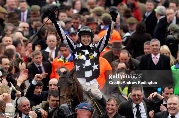 Paddy Brennan celebrates after riding Imperial Commander to victory in the Totesport Cheltenham Gold Cup on Day Four of the Cheltenham Festival on...