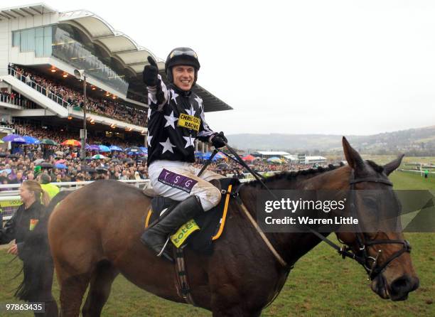 Paddy Brennan celebrates after riding Imperial Commander to victory in the Totesport Cheltenham Gold Cup on Day Four of the Cheltenham Festival on...