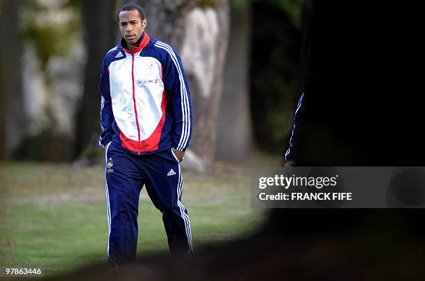 France national football team's captain Thierry Henry arrives for a press conference, on October 13, 2009 in Clairefontaine, southern Paris, on the...
