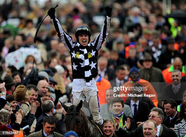 Paddy Brennan on Imperial Commander celebrates winning The Totesport Cheltenham Gold Cup Steeple Chase on Day 4 of the Cheltenham Festival on March...