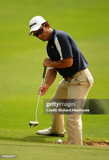 Ignacio Garrido of Spain putts while standing in a bunker on the 13th during the second round of the Hassan II Golf Trophy at Royal Golf Dar Es Salam...