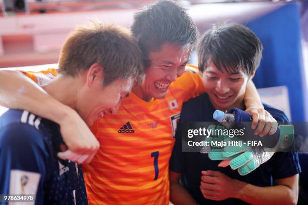 Eiji Kawashima of Japan celerbates with teammates following his sides victory in the 2018 FIFA World Cup Russia group H match between Colombia and...