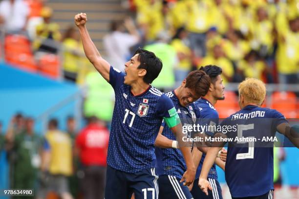 Makoto Hasebe of Japan celebrates with his team-mates at the end of the 2018 FIFA World Cup Russia group H match between Colombia and Japan at...