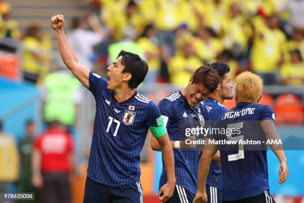 Makoto Hasebe of Japan celebrates with his team-mates at the end of the 2018 FIFA World Cup Russia group H match between Colombia and Japan at...