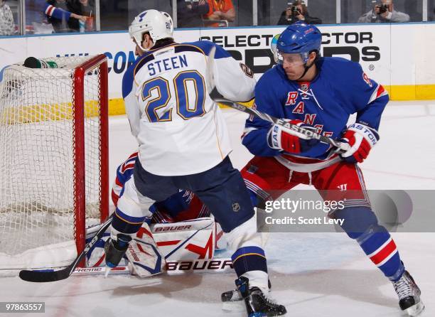 Matt Gilroy of the New York Rangers defends against Alexander Steen of the St. Louis Blues in the second period on March 18, 2010 at Madison Square...