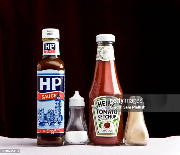 Two sauce bottles together with salt and pepper shakers on the 06th January 2010 in Ipswich in the United Kingdom. A homage to Ralph Goings...