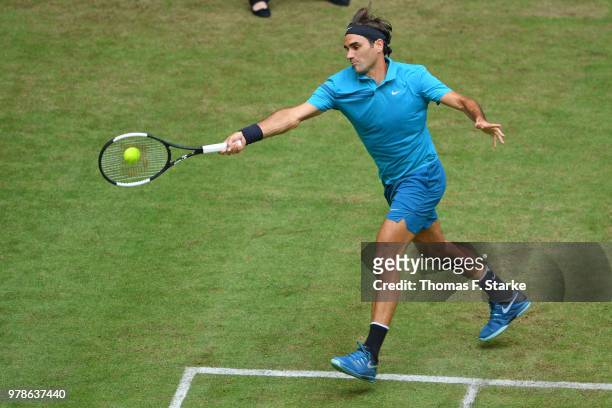 Reger Federer of Switzerland plays a forehand in his match against Aljaz Bedene of Slovenia during day two of the Gerry Weber Open at Gerry Weber...