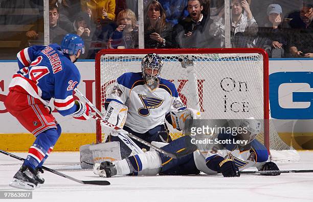 Ty Conklin and Barret Jackman of the St. Louis Blues protect the net against Ryan Callahan of the New York Rangers on March 18, 2010 at Madison...