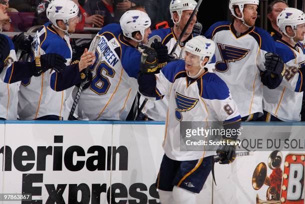 Paul Kariya of the St. Louis Blues is congratulated by teammates for his game winning goal against the New York Rangers on March 18, 2010 at Madison...