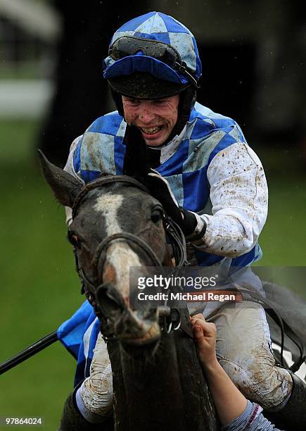 Andrew Lynch celebrates riding Berties Dream to victory in The Albert Bartlett Novices' Hurdle Race on Day 4 of the Cheltenham Festival on March 19,...