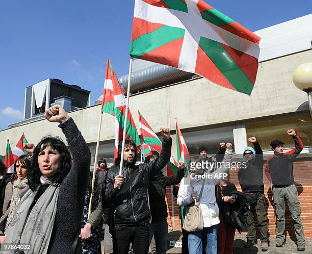 Members of the Jon Anza Committee, a member of the armed Basque separatist group ETA who disappeared nearly a year ago, sing during a demonstration...