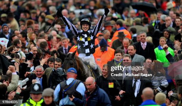 Paddy Brennan on Imperial Commander celebrates winning The Totesport Cheltenham Gold Cup Steeple Chase on Day 4 of the Cheltenham Festival on March...