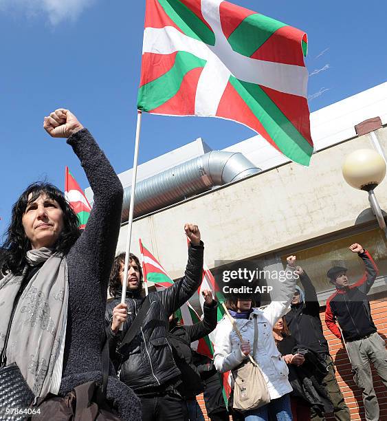 Members of the Jon Anza Committee, a member of the armed Basque separatist group ETA who disappeared nearly a year ago, sing during a demonstration...