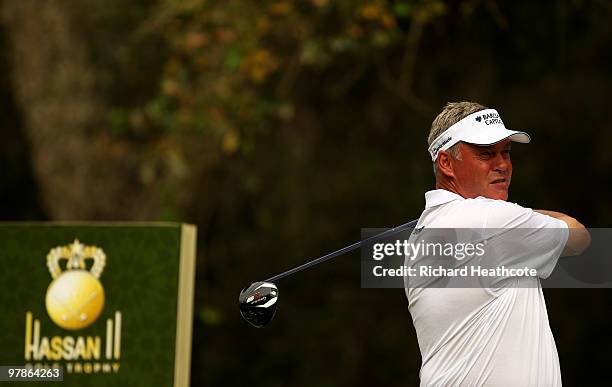 Darren Clarke of Northern Ireland tee's off at the 15th during the second round of the Hassan II Golf Trophy at Royal Golf Dar Es Salam on March 19,...