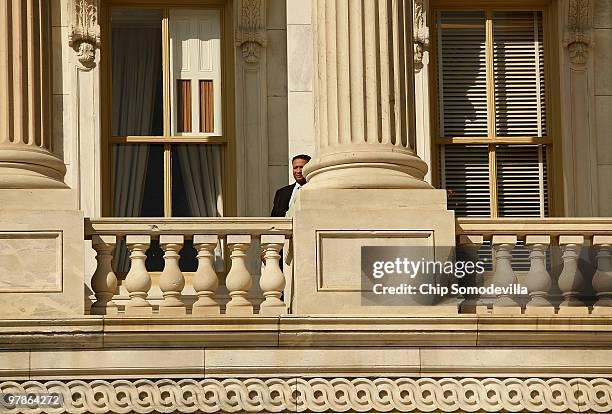 Rep. Artur Davis talks on the phone while standing on a balcony outside the U.S. Capitol March 19, 2010 in Washington, DC. Davis, who is running for...
