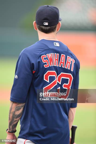Blake Swihart of the Boston Red Sox looks on during batting practice of a baseball game against the Baltimore Orioles at Oriole Park at Camden Yards...