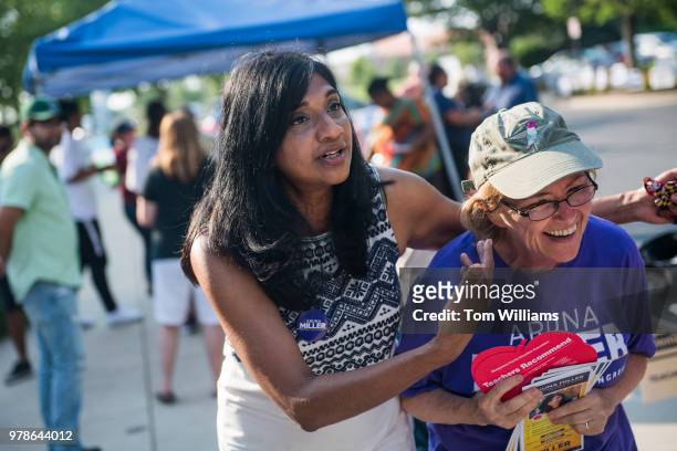 Aruna Miller, left, who is running for the Democratic nomination in Maryland's 6th Congressional District, talks with campaign volunteer Elly...