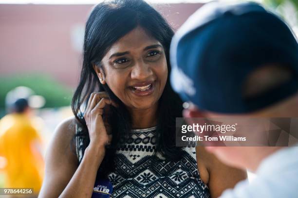 Aruna Miller, who is running for the Democratic nomination in Maryland's 6th Congressional District, talks with citizens during early voting at the...