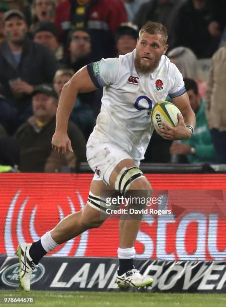 Brad Shields of England runs with the ball during the second test match between South Africa and England at Toyota Stadium on June 16, 2018 in...