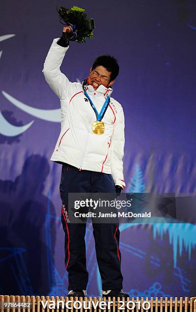 Gold medalist Yoshihiro Nitta of Japan celebrates during the medal ceremony for the Men's 10km Classic Standing Cross Country on Day 7 of the 2010...