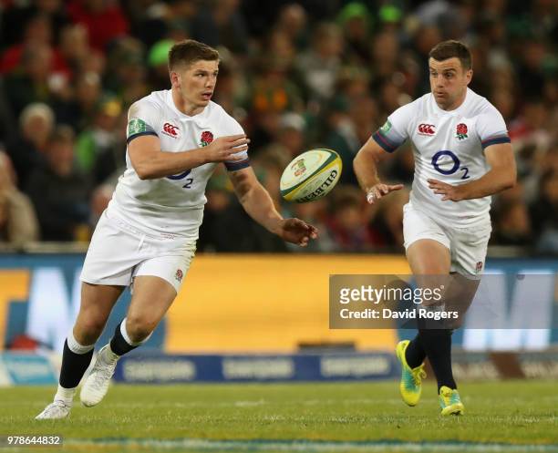 Owen Farrell passes the ball as George Ford adds support during the second test match between South Africa and England at Toyota Stadium on June 16,...