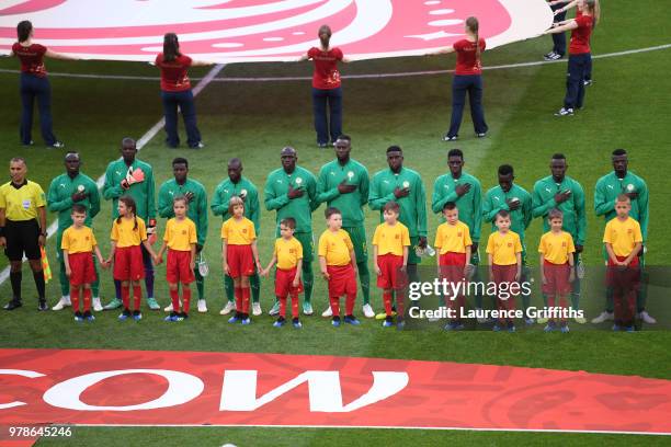 Senegal team lines up prior to the 2018 FIFA World Cup Russia group H match between Poland and Senegal at Spartak Stadium on June 19, 2018 in Moscow,...