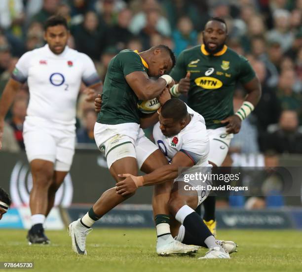 Alphiwe Dyanti of South Africa is tackled by Kyle Sinckler during the second test match between South Africa and England at Toyota Stadium on June...