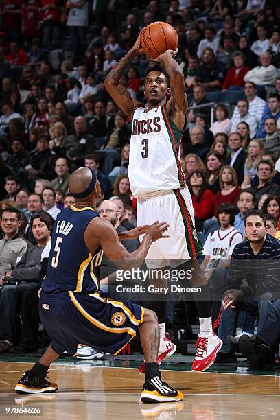 Brandon Jennings of the Milwaukee Bucks shoots over T.J. Ford of the Indiana Pacers during the game on February 6, 2010 at the Bradley Center in...