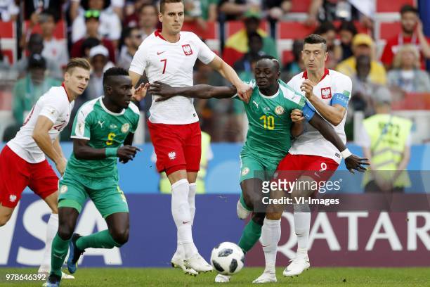 Idrissa Gana Gueye of Senegal, Arkadiusz Milik of Poland, Sadio Mane of Senegal, Robert Lewandowski of Poland during the 2018 FIFA World Cup Russia...