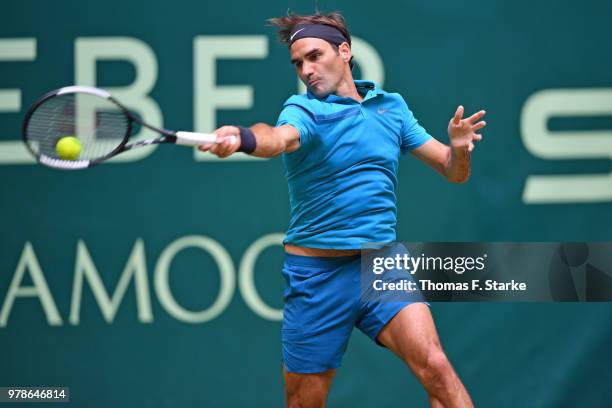 Reger Federer of Switzerland plays a forehand in his match against Aljaz Bedene of Slovenia during day two of the Gerry Weber Open at Gerry Weber...