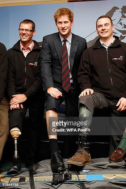 Prince Harry poses with a group of military servicemen, wounded in the line of duty and who subsequently lost limbs on March 19, 2010 in London. The...