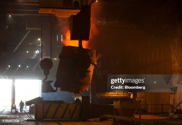 Workers operate a giant ladle in the converter shop at the Novolipetsk Steel PJSC plant, operated by NLMK Group, in Lipetsk, Russia, on Monday, June...