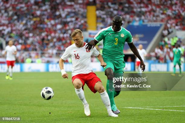 Kalidou Koulibaly of Senegal and Jakub Blaszczykowski of Poland compete for the ball during the 2018 FIFA World Cup Russia group H match between...