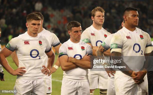 Owen Farrell, the England captain looks on with George Ford, Joe Launchbury and Nathan Hughes after their defeat during the second test match between...