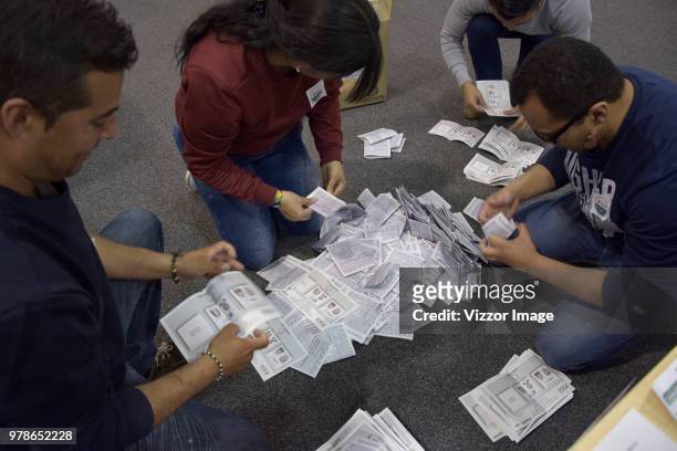 Electoral juries count votes during the presidential ballotage between Conservative Ivan Duque and leftist Gustavo Petro on June 17, 2018 in Bogota,...