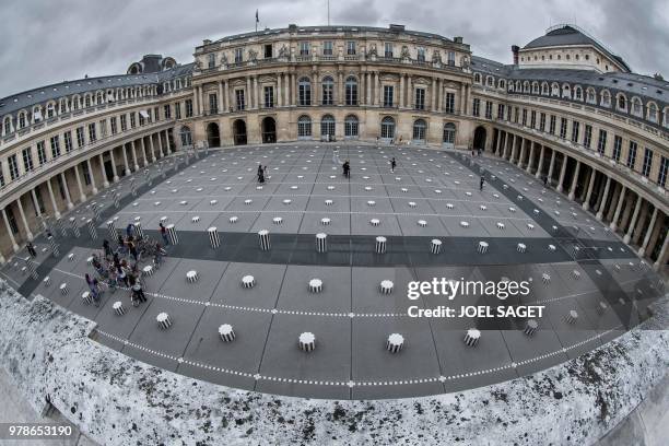 This general view taken with a fisheye lens shows The Ministry of Culture and la Comédie Française at The Colonnes de Buren , an art installation by...