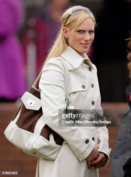 Zara Phillips watches the racing as she attends 'Ladies Day' on day 3 of the Cheltenham Horse Racing Festival on March 18, 2010 in Cheltenham,...