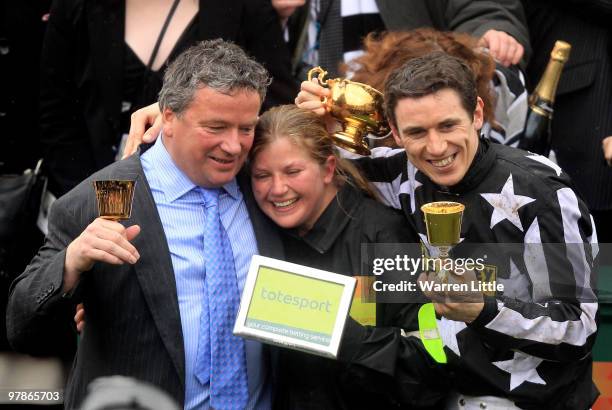Paddy Brennan poses with the Gold Cup after riding Imperial Commander to victory in the Totesport Cheltenham Gold Cup on Day Four of the Cheltenham...