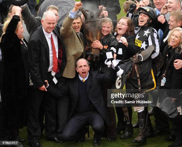 Paddy Brennan , horse Imperial Commander and team celebrate winning the Gold Cup at the Cheltenham Festival on March 19, 2010 in Cheltenham, England.
