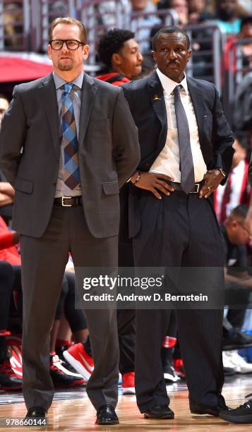 Nick Nurse and Dwayne Casey of the Toronto Raptors look on during the game against the Los Angeles Clippers on December 11, 2017 at STAPLES Center in...