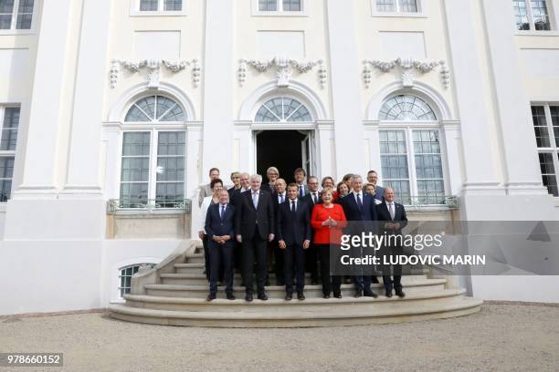 Chancellor Angela Merkel and French President Emmanuel Macron pose with their Ministers, including French Interior Minister Gerard Collomb , Interior...