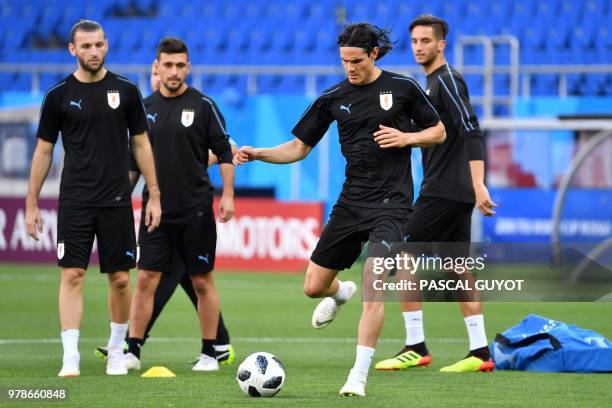 Uruguay's forward Edinson Cavani and his teammates take part in a training session at the Rostov Arena in Rostov-On-Don on June 19 on the eve of the...