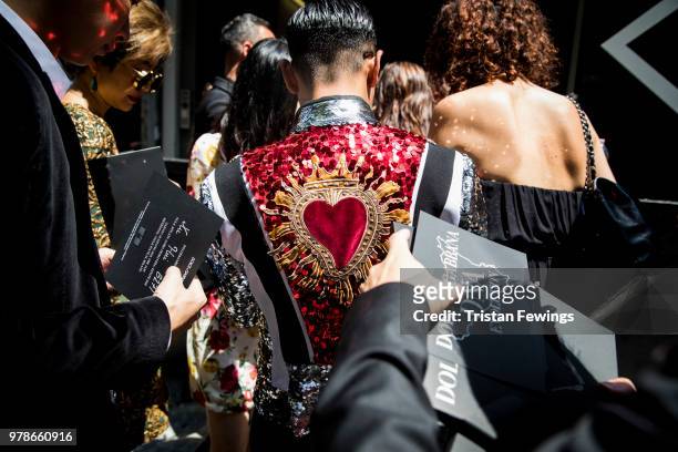 People wait to get into the Dolce & Gabbana show during Milan Men's Fashion Week Spring/Summer 2019 on June 16, 2018 in Milan, Italy.
