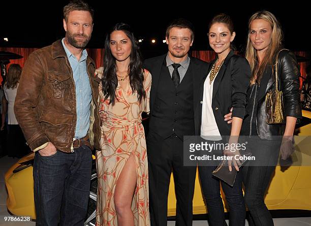 Actors Aaron Eckhart, Olivia Munn, Jeremy Renner, TV personality Maria Menounos, and actress Molly Sims attend the Ferrari 458 Italia auction event...