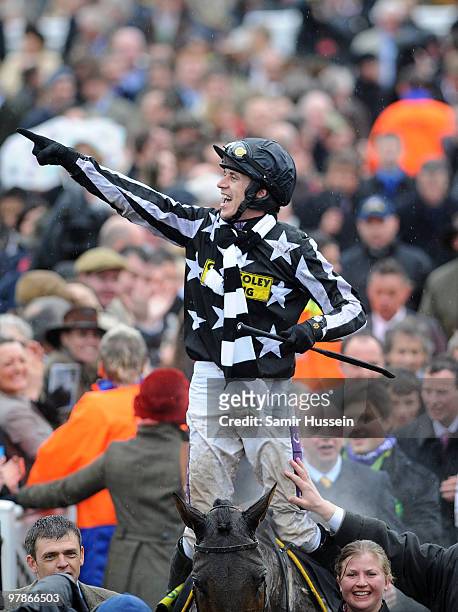 Paddy Brennan riding Imperial Commander celebrates winning the Gold Cup at the Cheltenham Festival on March 19, 2010 in Cheltenham, England.