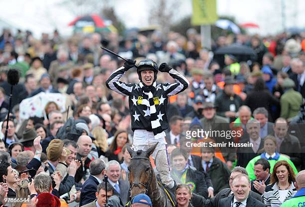 Paddy Brennan riding Imperial Commander celebrates winning the Gold Cup at the Cheltenham Festival on March 19, 2010 in Cheltenham, England.